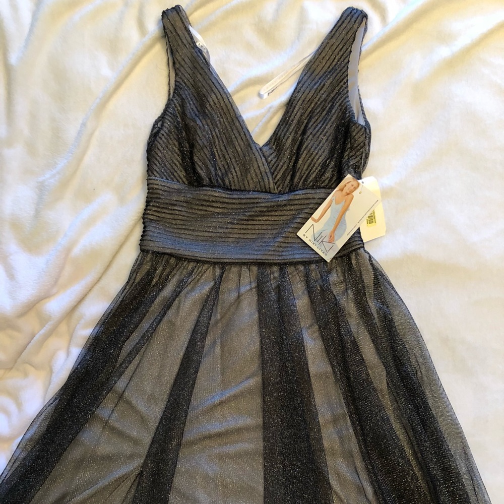 Brand new dress with tags size 6 for after 5!